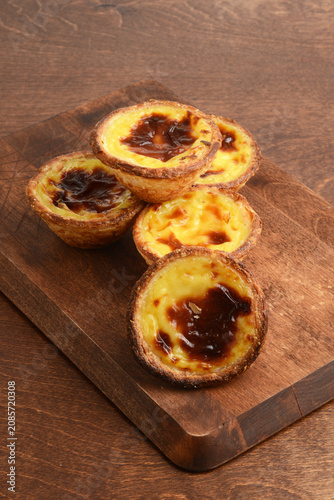 pile of Portuguese Custard Tarts On a cutting board