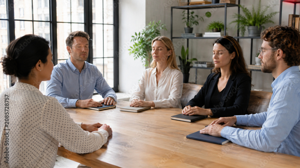 Fototapeta premium Office team taking a mindful pause during a quiet workday