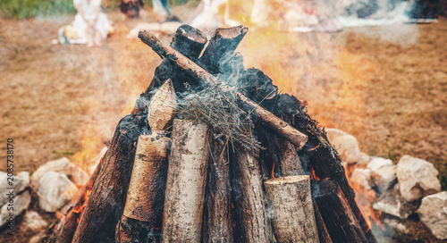 Ceremonial throwing of lavender into the sacred solstice fire.
