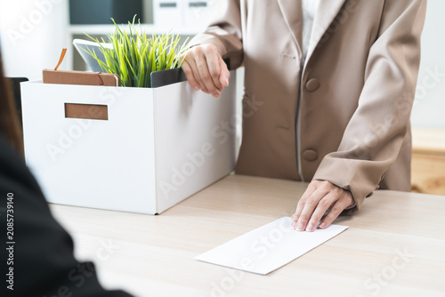 Fotografie Unemployment quitting job, desperate asian young business woman send resignation