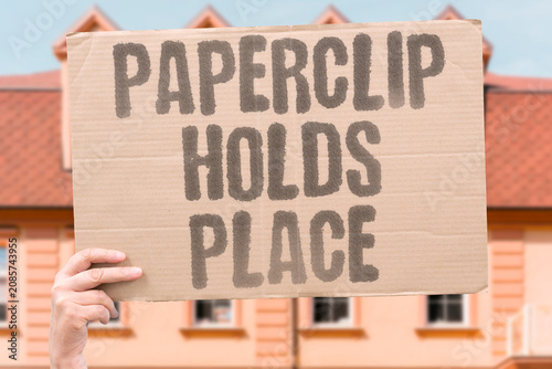 Fotografie "Paperclip holds place" Small objects create order in chaos