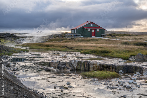 Geothermal hot spring with traditional house, Iceland