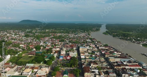 Drone view of Cotabato City with small houses near the river. Mindanao, Philippines. Cityscape.