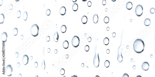 Fotografie Clear water drops on a glass window pane after rain