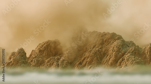 Rocky coastline shrouded in mist and warm golden haze, atmospheric seascape with rugged cliffs and soft surf evoking calm solitude