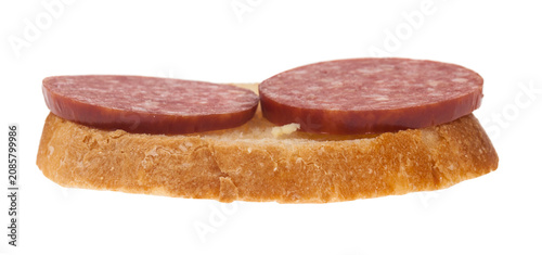 Foto Sausage and bread isolated on a white background.