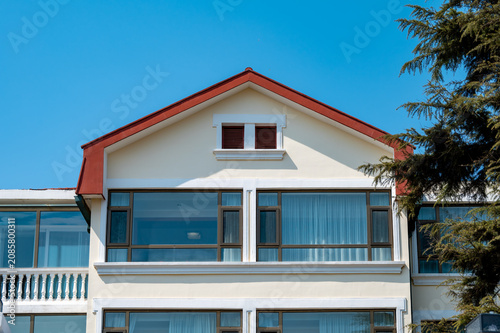 Foto Red-Tile Pitched Roof with Dormer Window Architectural Close-up