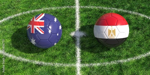 Foto Australia versus Egypt soccer balls on green field grass center circle kickoff