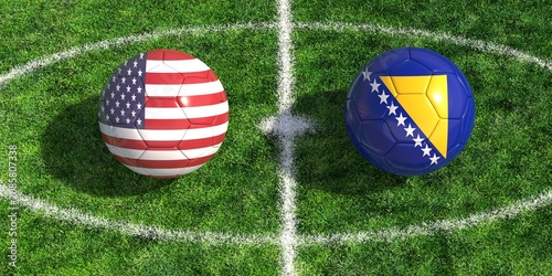 Bild auf Leinwand Soccer balls with flags of USA and Bosnia on green grass football field