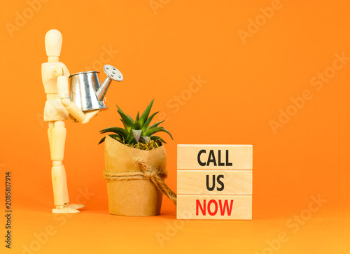 Fotografie Call us now words symbol