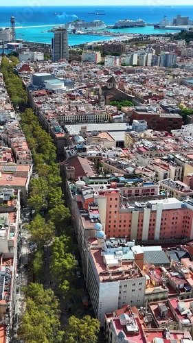 Urban crowd and street atmosphere on Barcelona La Rambla showing dynamic city life and tourism.