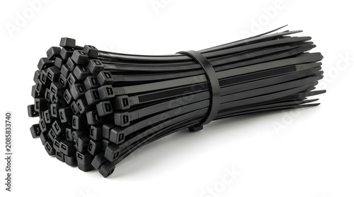 A bundle of black cable ties neatly organized and secured with a rubber band on a white surface.