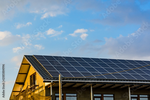 Solar panels on roof of residential house. Clean energy. Ecological concept