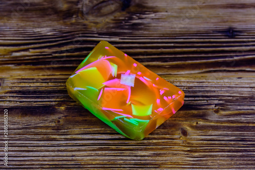 Piece of the handmade soap on wooden background