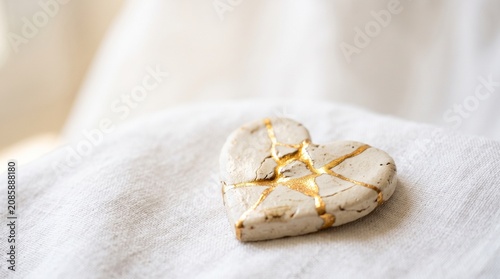 Broken Heart Mended with Gold Kintsugi Symbolizing Forgiveness and Healing on Global Forgiveness Day