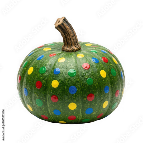 Colorful painted pumpkin with polka dots isolated on white background