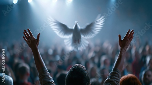 Crowd of people raising hands worshiping the Holy Spirit flying over the crowd of believers	
