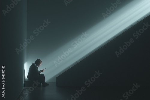 Contemplative moment a person sitting in dim light with rays illuminating the space capturing solitude and reflection