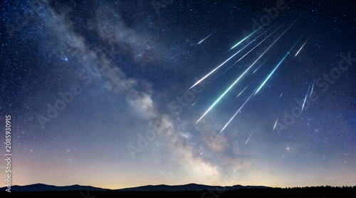 Night sky with shooting stars and the Milky Way in the background  