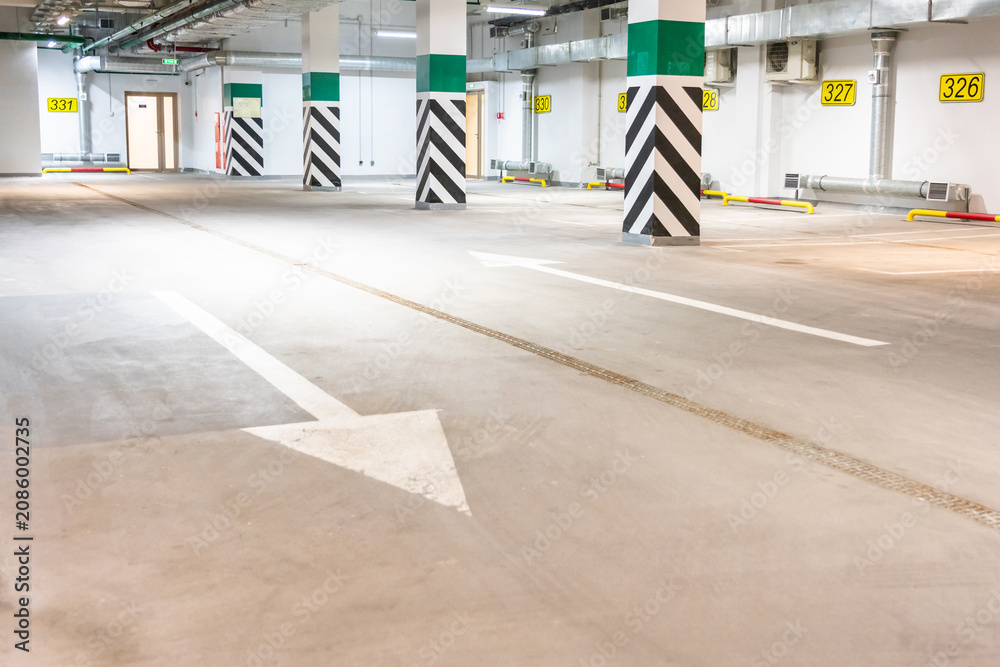Obraz premium Underground parking garage, empty modern industrial interior