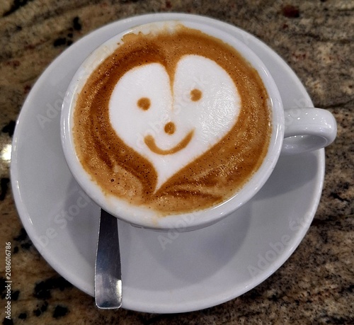Cappuccino with foam and smiling face