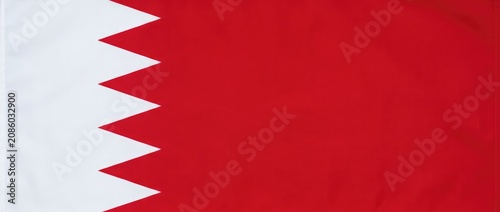 Flag of Bahrain, close-up, detailed fabric texture, national symbol
