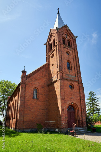 Historic, neo-Gothic Catholic church with a bell tower in the village of Nakielno