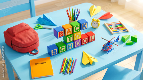 Back to school colorful text on bright sky blue background with kids backpack notebook helicopters flat lay