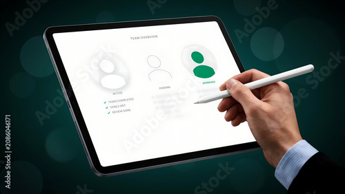 Business professional using a digital tablet with a stylus to manage team tasks and project status overview