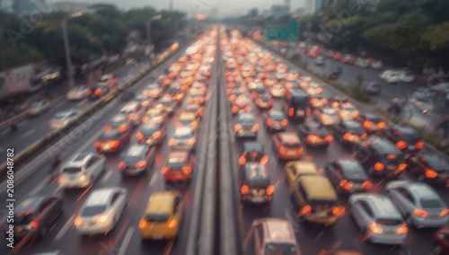 Blurred background of Jakarta's city highway, congested with vehicles during the afternoon.