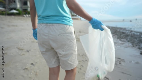 Save water. Volunteer pick up trash garbage at the beach and plastic bottles are difficult decompose prevent harm aquatic life. Earth, Environment, Greening planet, reduce global warming, Save world