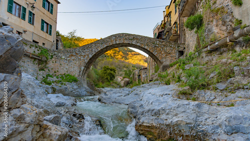 Foto It is a Romanesque stone bridge that crosses the Neva River in the ancient medieval village of Zuccarello, in the province of Savona, Liguria, Italy