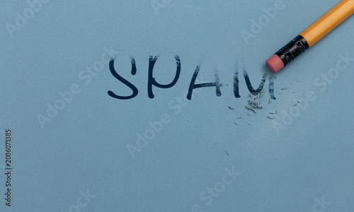 фотографія Conceptual image of a pencil erasing the word spam, symbolizing spam filtering, cybersecurity, digital protection, email security and online safety