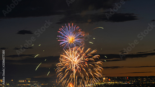 Fireworks over the Rio Grande Valley for the 250th birthday of the USA near Albuquerque New Mexico at sunset