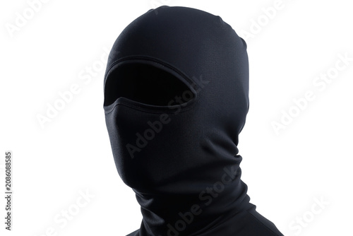 Black Balaclava Mask Covering Head and Neck Against Dark Background headwear face