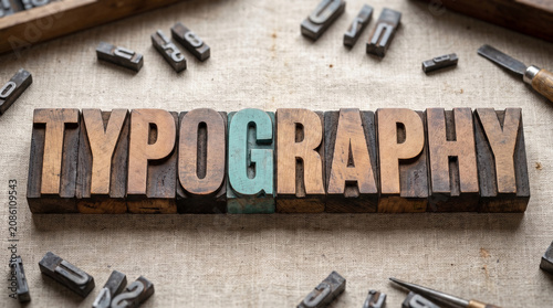 Antique wooden letterpress blocks spelling typography on fabric