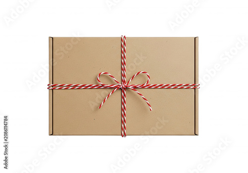 Small cardboard shipping box tied with red and white festive baker twine isolated on transparent background