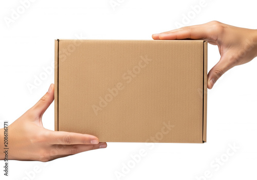 Human hands holding cardboard parcel box for shipping and delivery isolated on transparent background cutout