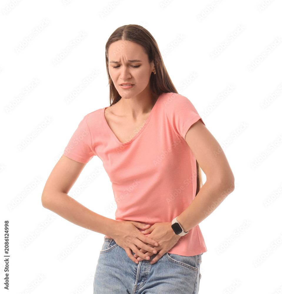 Obraz premium Young woman with stomach pain holding abdomen
