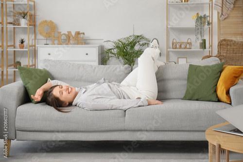Beautiful young woman lying...