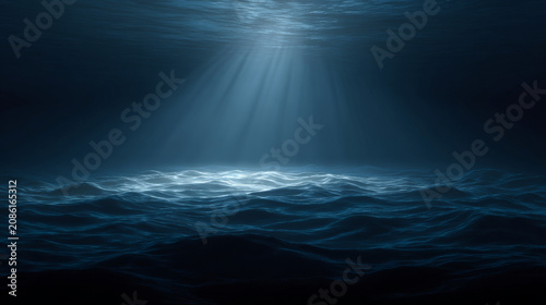 Underwater deep sea with dark blue waves and light rays shining through water surface creating mysterious and calm atmosphere