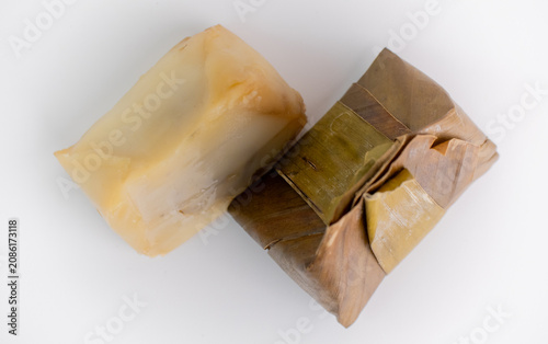 Opened Indonesian Kue Bugis Showing Sticky Rice Texture on White Background