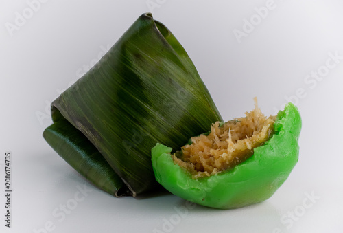 Kue Bugis, Indonesian Green Coconut Filled Dumpling beside Banana Leaf Wrapper