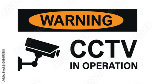 A bold rectangular warning sign featuring black text and a surveillance camera icon for security monitoring