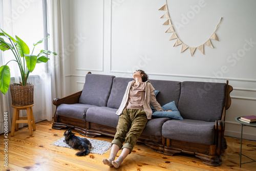 Tableau sur toile Home boredom, laziness and procrastination, peaceful careless woman resting on couch doing nothing, inactive lazy female distracted by thoughts idling on sofa, dreamy peaceful rest and dallying