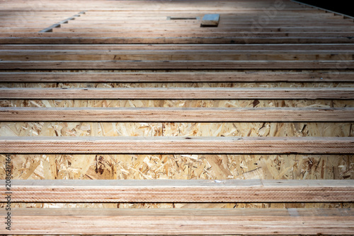 Fotografie Wood i-beam floor joists installed at new home build, OSB oriented strand board,