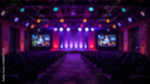 Blurred conference hall stage lighting purple blue mood modern event space