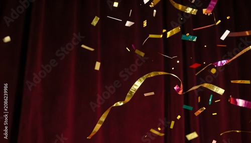 Luxury colorful confetti and ribbons on a dark background, creating an elegant festive atmosphere