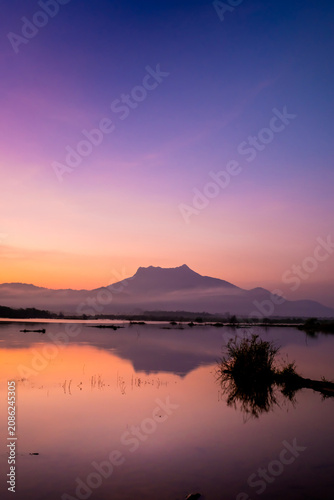 Morning at Reservoir with a mountain backdrop,reservoir featuring a large mountain formation in the background, Khlong Hin Reservoir, Krabi