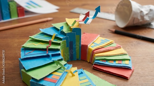 Colorful paper pie charts on desk